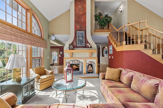 living room featuring high vaulted ceiling and light hardwood / wood-style floors