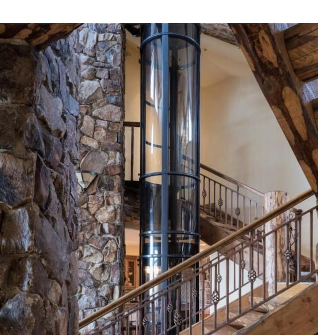 staircase featuring hardwood / wood-style floors