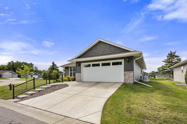 view of front of home with a garage and a front yard