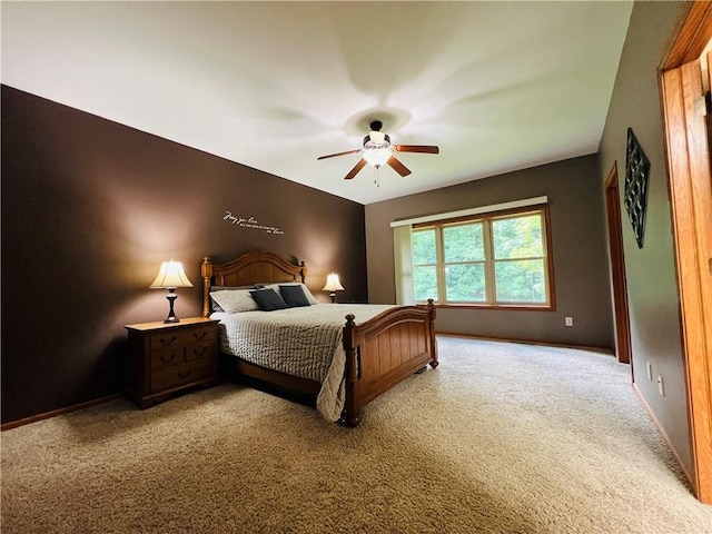 bedroom featuring ceiling fan and light carpet