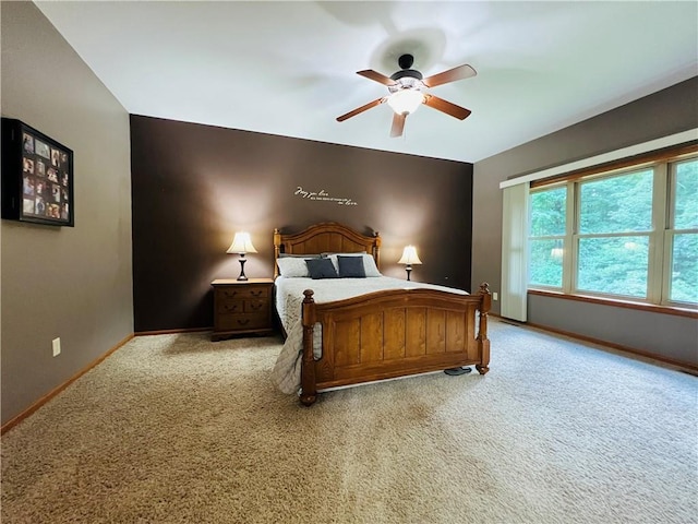 bedroom with ceiling fan and carpet flooring