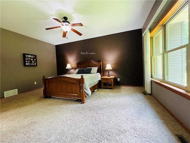 bedroom with light carpet and ceiling fan