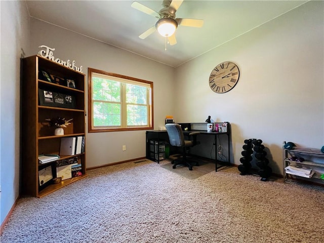 carpeted office space with lofted ceiling and ceiling fan