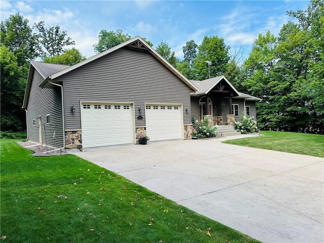 view of front facade with a garage and a front yard