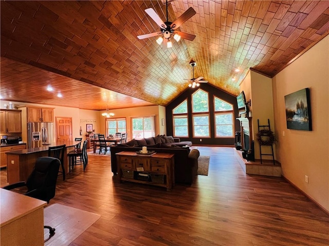 living room featuring brick ceiling, vaulted ceiling, dark hardwood / wood-style floors, and ceiling fan with notable chandelier