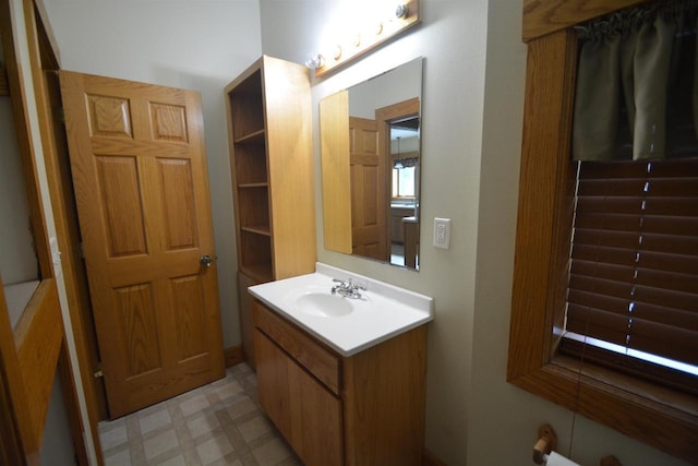 bathroom with vanity and tile patterned floors