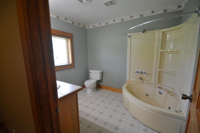 full bathroom with visible vents, a combined bath / shower with jetted tub, baseboards, toilet, and vanity