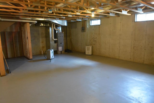 basement with a wealth of natural light and heating unit