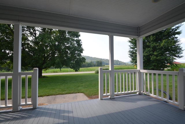 wooden deck with a yard