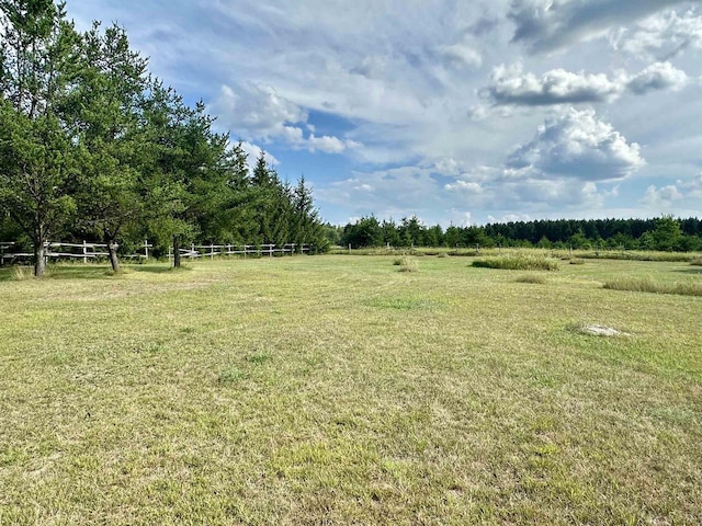 view of yard with a rural view