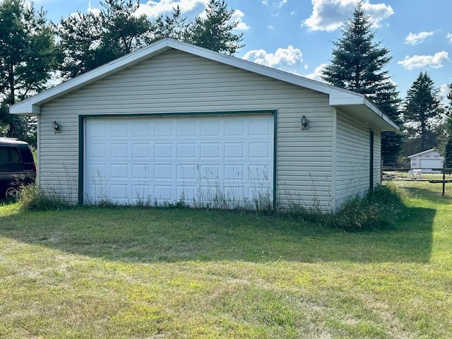 garage with a yard