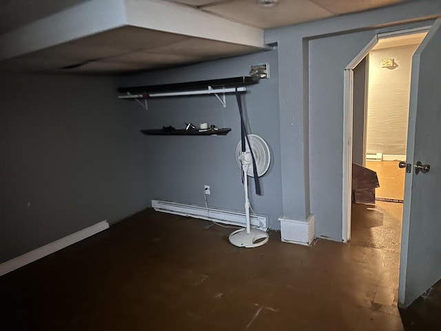 basement featuring a baseboard heating unit