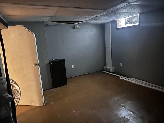 basement with a baseboard heating unit