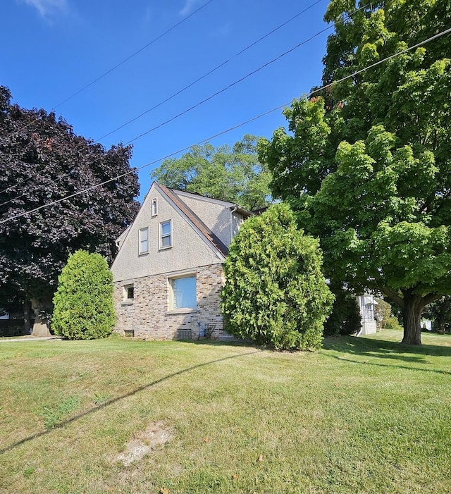 view of home's exterior with a yard