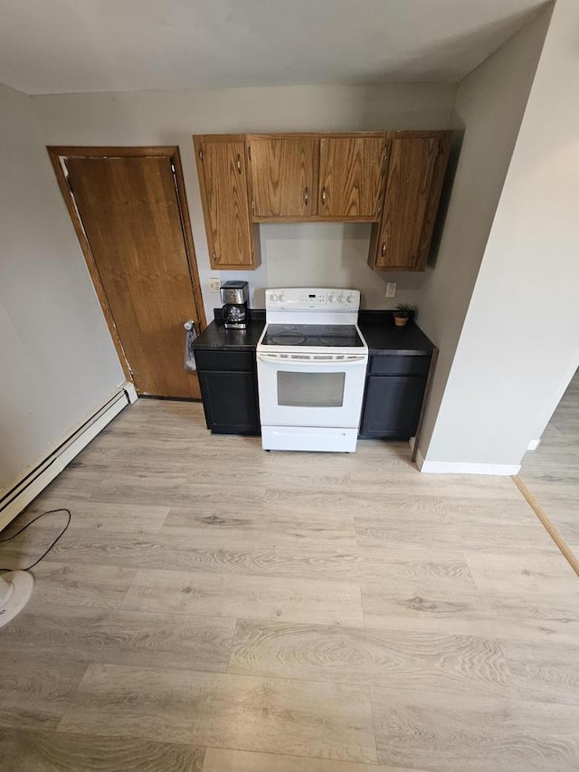 kitchen featuring white electric range, light wood-type flooring, and baseboard heating