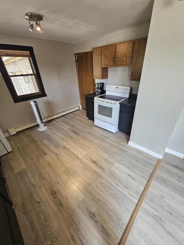 kitchen featuring white range with electric stovetop, light hardwood / wood-style floors, and baseboard heating