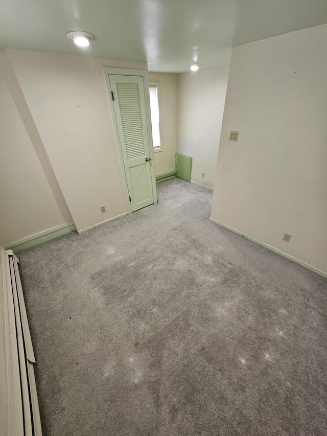 spare room with light colored carpet