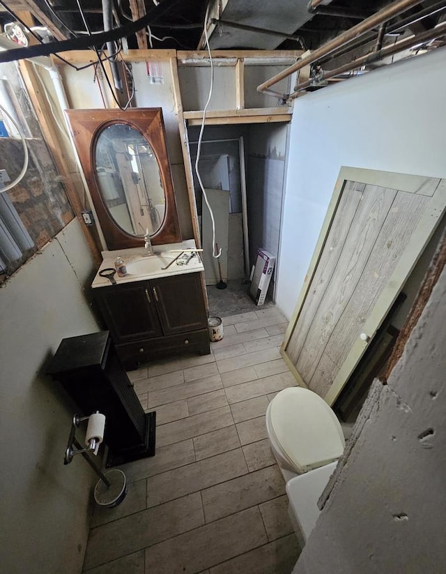 bathroom featuring toilet and vanity