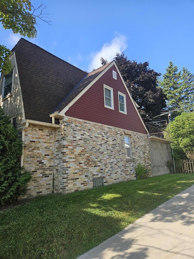 view of property exterior with a yard