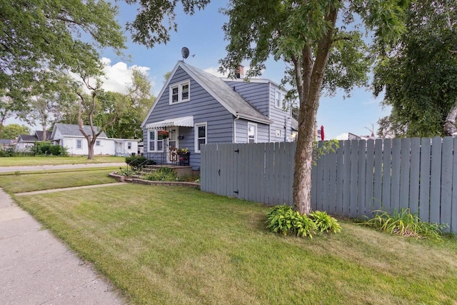 view of side of home featuring a yard