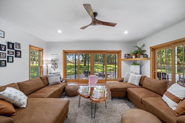 living room featuring ceiling fan and plenty of natural light