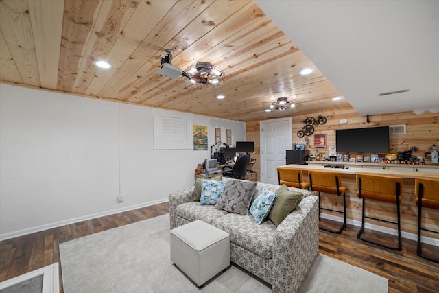 living room featuring wooden walls, wood ceiling, and hardwood / wood-style flooring