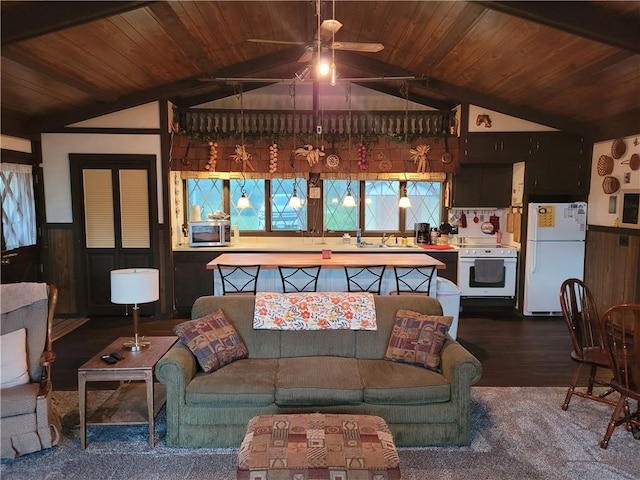 living room with lofted ceiling, wood ceiling, dark wood-type flooring, and wainscoting