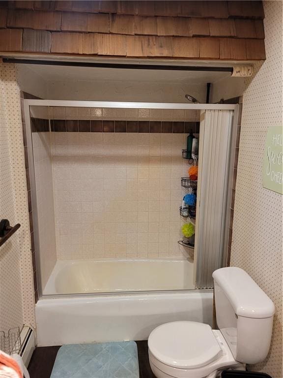 full bathroom featuring toilet, wallpapered walls, a baseboard radiator, and shower / bath combination with glass door