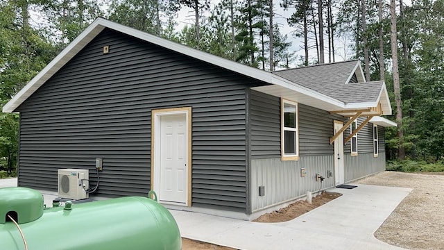 view of side of property featuring ac unit