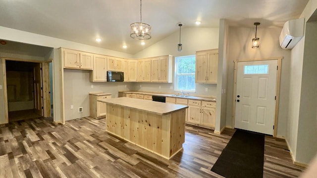 kitchen with an AC wall unit, lofted ceiling, a kitchen island, and hardwood / wood-style floors