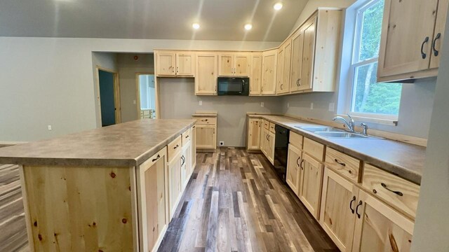 kitchen featuring sink, a kitchen island, dark hardwood / wood-style flooring, black appliances, and light brown cabinets