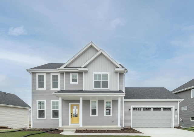 5607 Golden Dusk Pkwy, Madison, WI 53718 - view of front of house featuring a porch, a garage, and a front yard