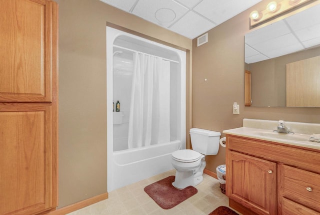 full bathroom featuring vanity, a paneled ceiling, shower / bath combo, and toilet