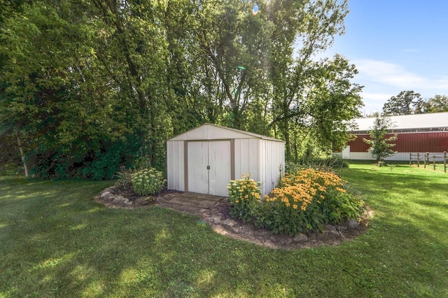 view of outbuilding with a yard