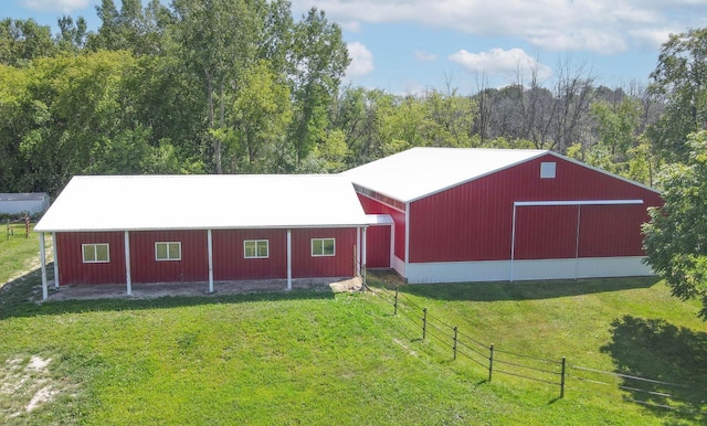 view of outbuilding featuring a yard