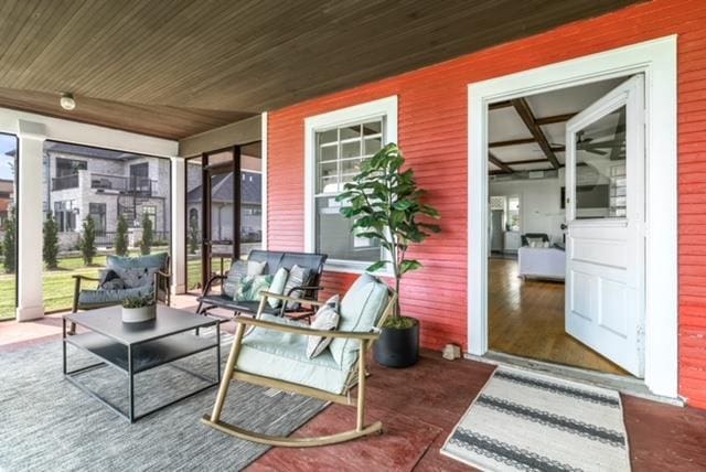 sunroom / solarium featuring wood ceiling