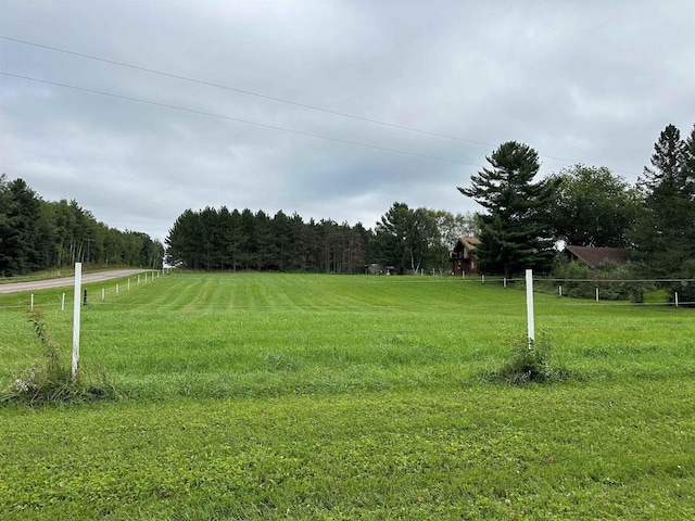 W6769 County Road D, Sheldon, WI 54766 - view of grassy yard with a forest view