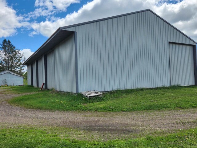 W6769 County Road D, Sheldon, WI 54766 - view of pole building featuring a lawn