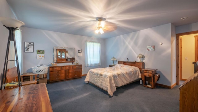 bedroom featuring ceiling fan and dark colored carpet