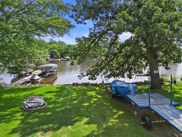 exterior space with a water view and a yard