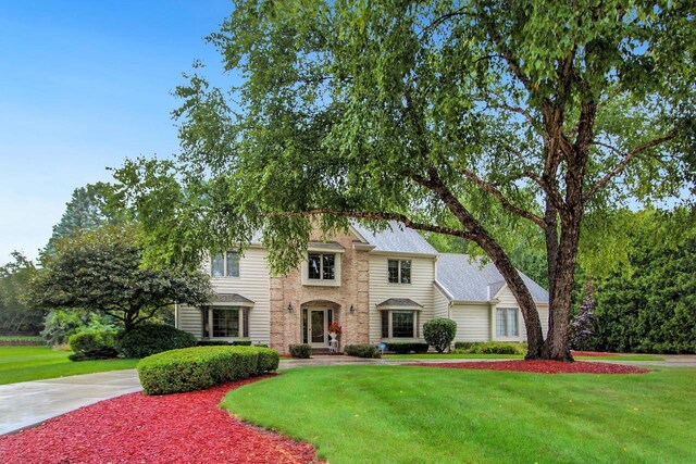 view of front of home with a front yard