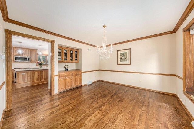 kitchen featuring stainless steel refrigerator with ice dispenser, tasteful backsplash, a kitchen island, and wood-type flooring