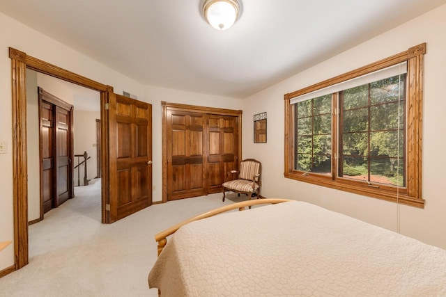 bedroom featuring light carpet