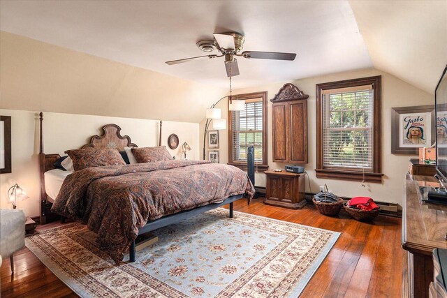 bedroom featuring hardwood / wood-style flooring, ceiling fan, and vaulted ceiling