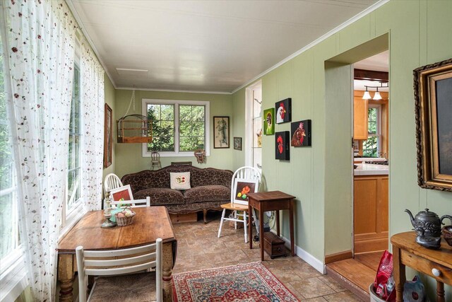 interior space featuring crown molding and a healthy amount of sunlight