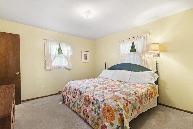 bedroom with light carpet