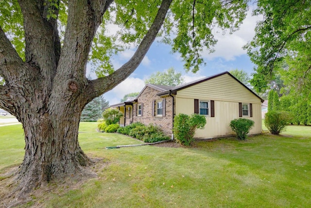 view of home's exterior featuring a lawn