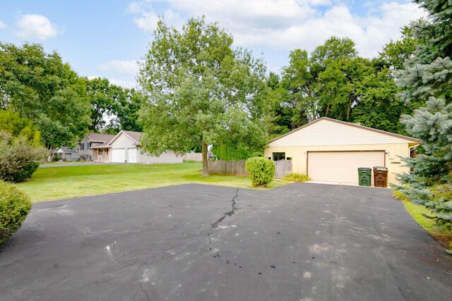 exterior space featuring a front lawn and a garage