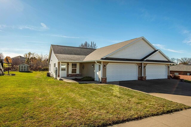 view of front of house with a garage and a front lawn