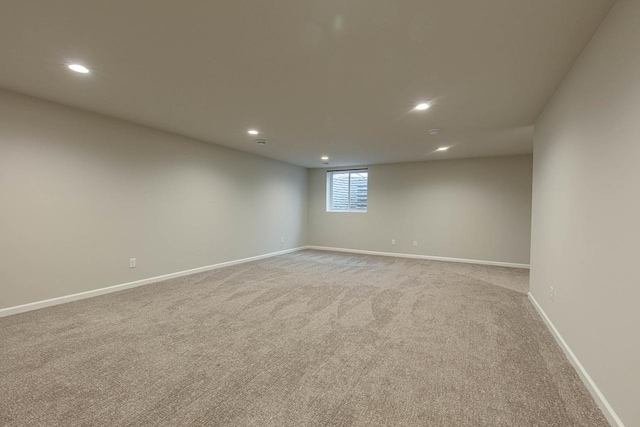 empty room featuring light colored carpet